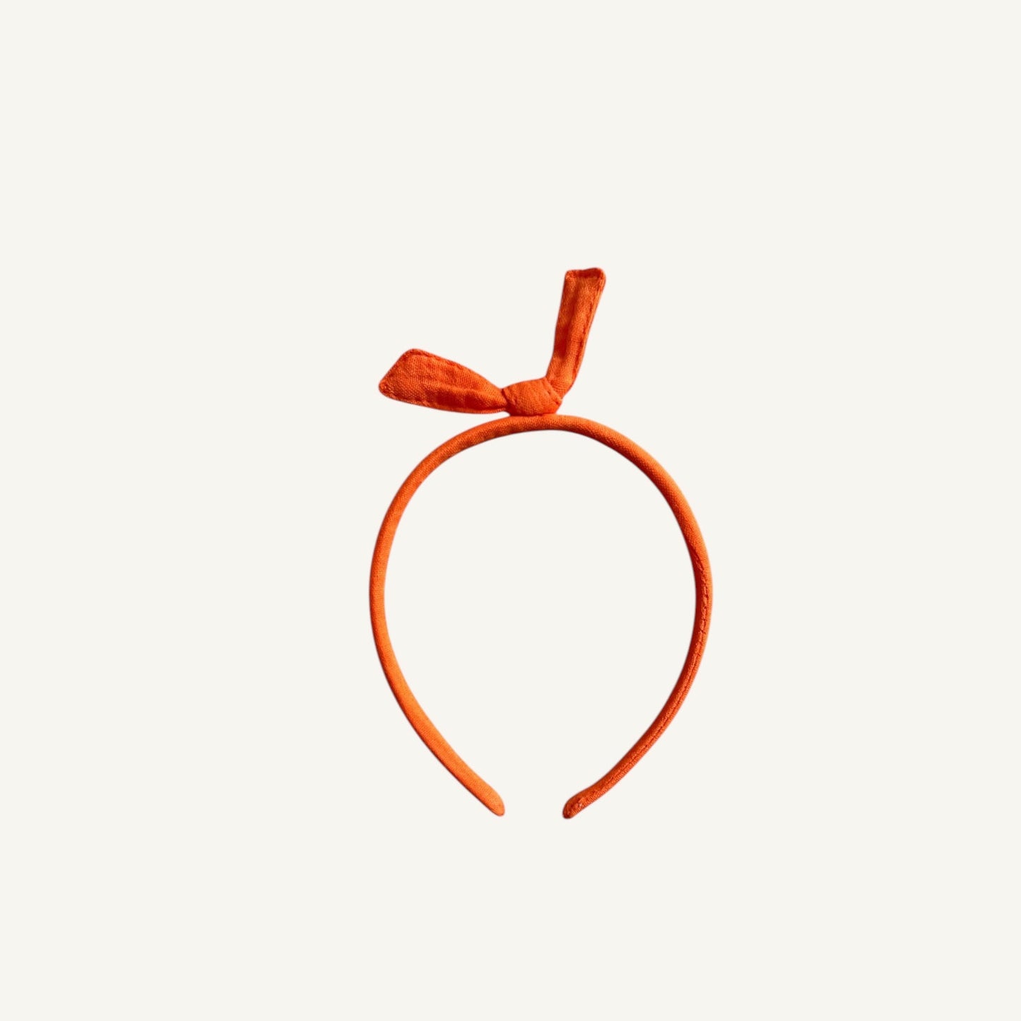 diadema niña: con lazo color naranja